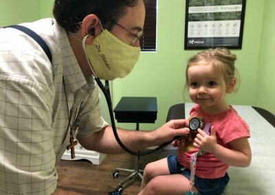 Dr. Fletcher Working with a Young Patient